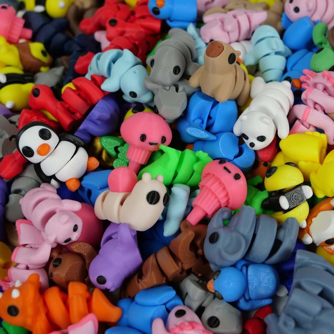 Colorful pile of mini articulated animal figures