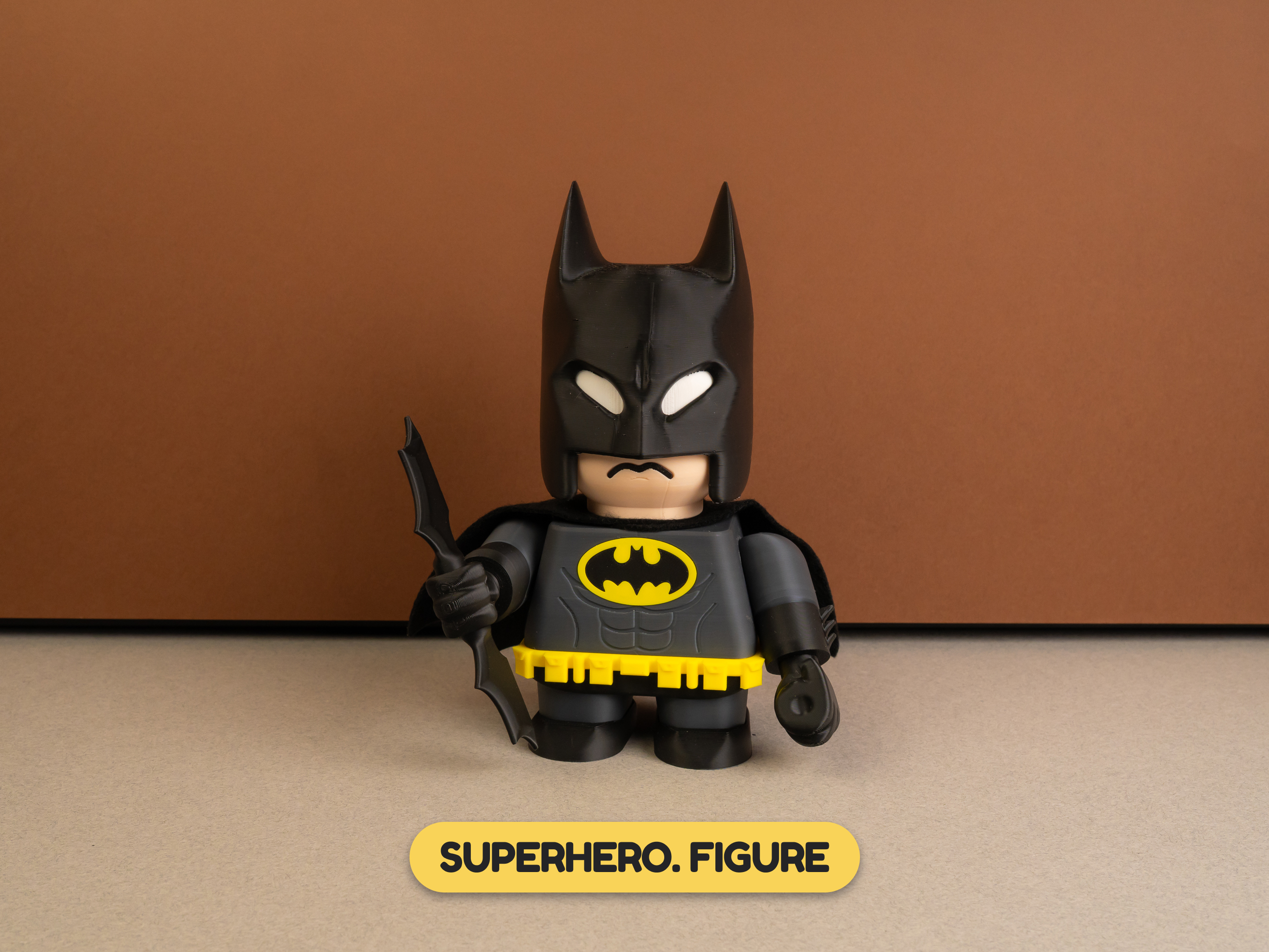 Superhero figure in black costume holding a tool