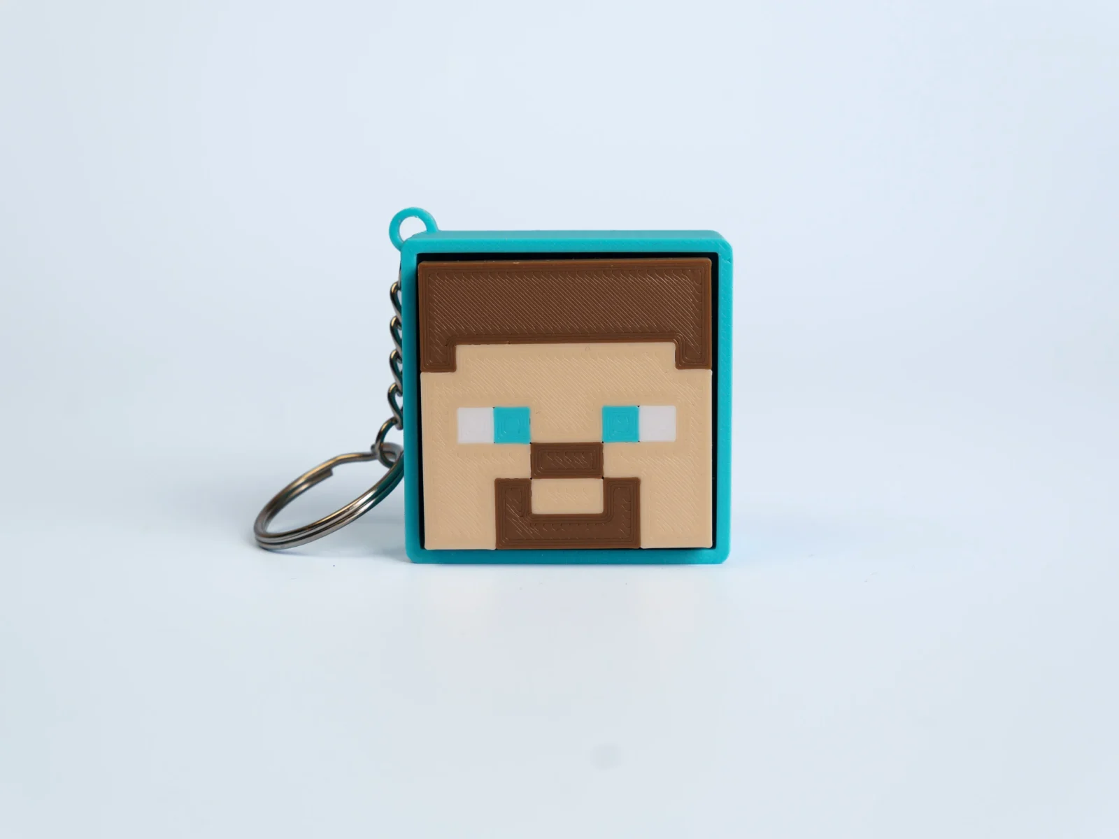 Pixel Block World clicker fidget keychain - blue eyed pixel man