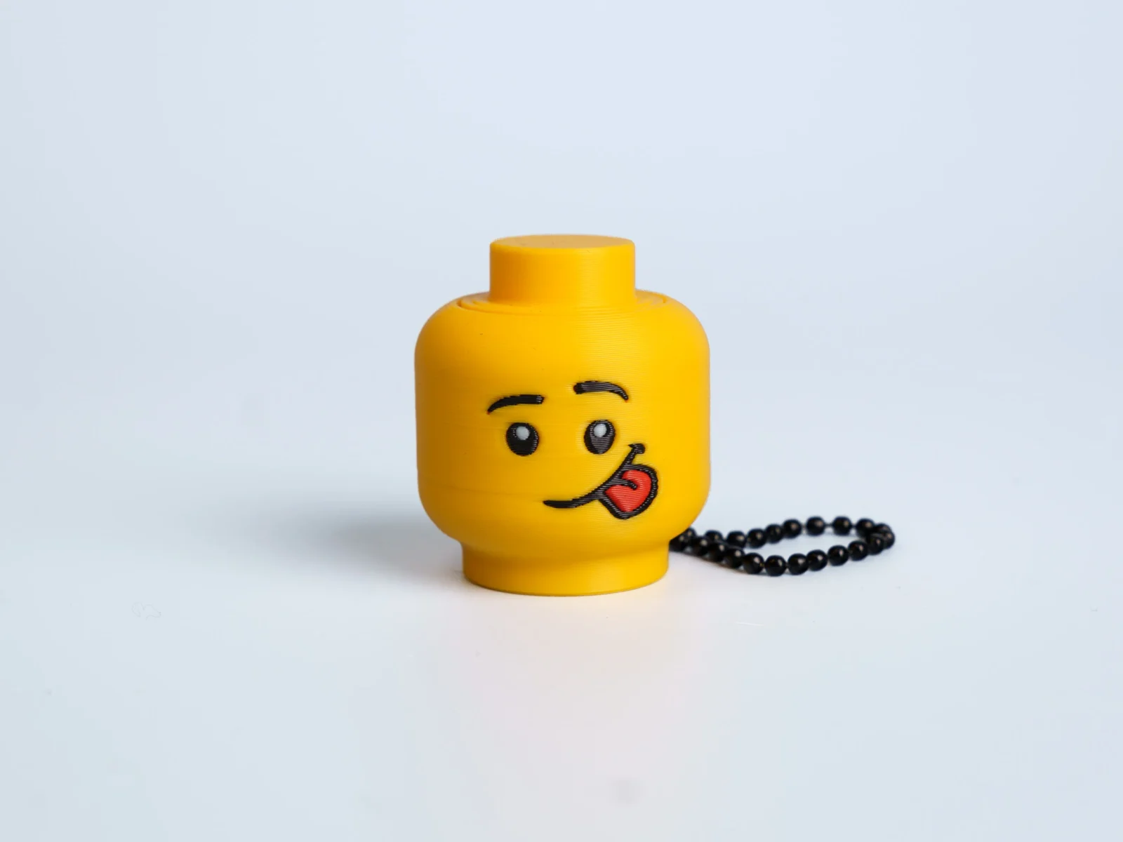 Yellow Expression Faces clicker fidget keychain - tongue out face