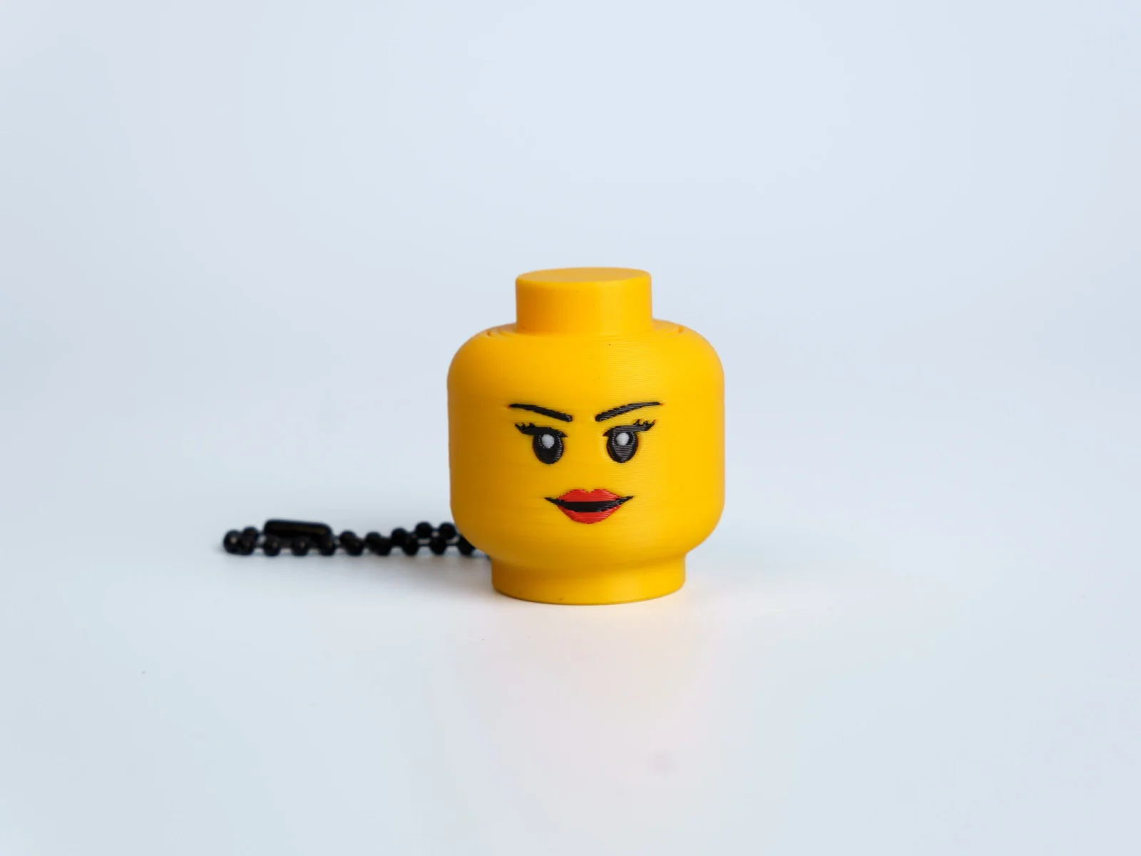 Yellow Expression Faces clicker fidget keychain - lipstick face