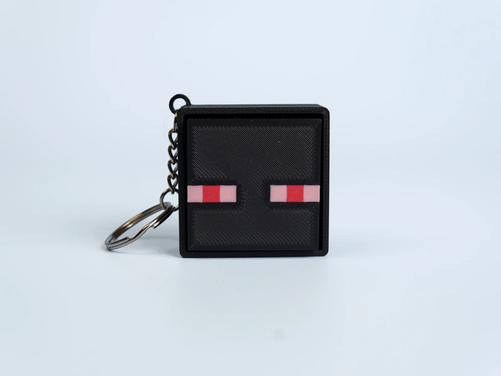 Pixel Block World clicker fidget keychain - red eyed pixel creature