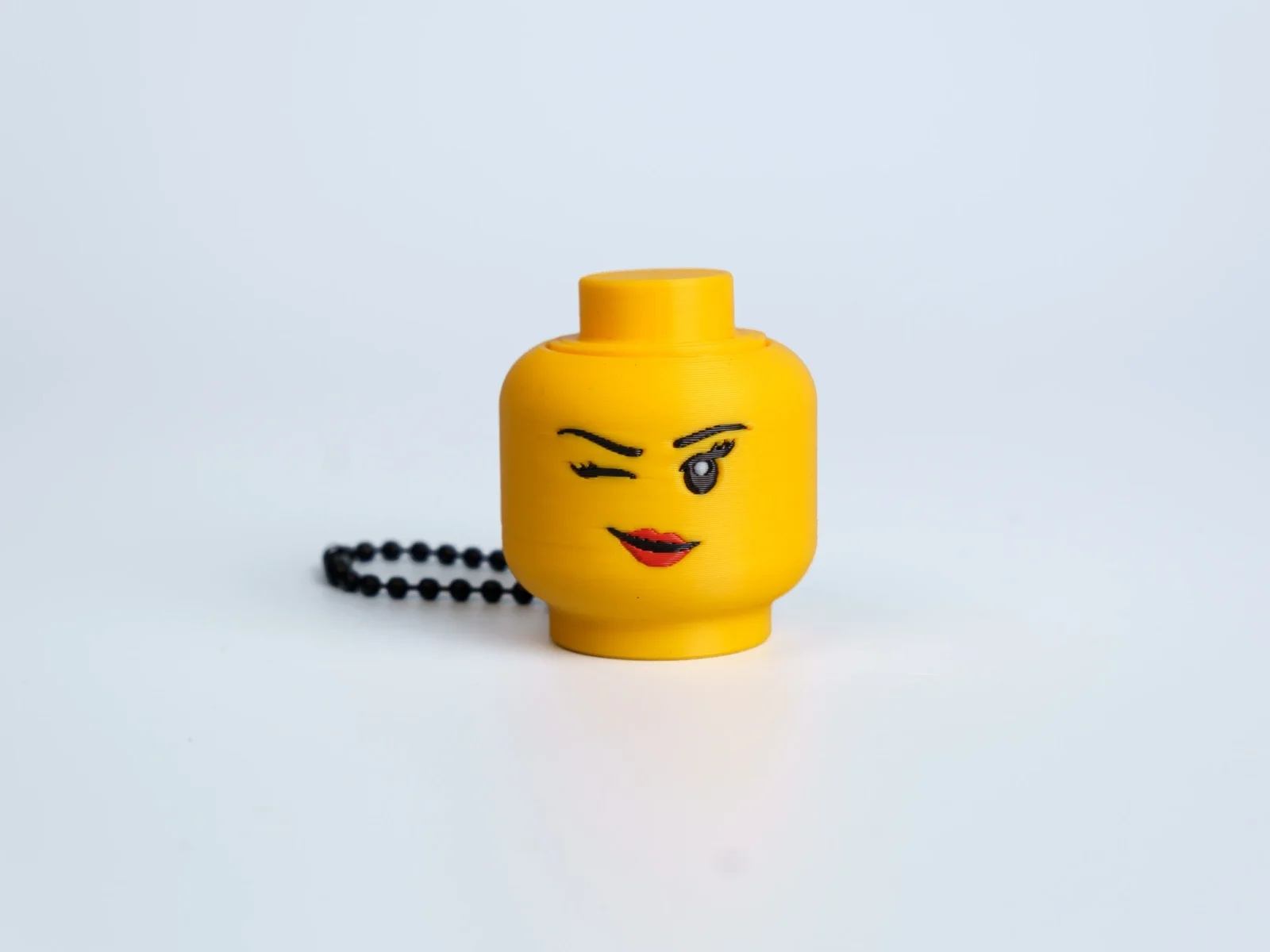 Yellow Expression Faces clicker fidget keychain - winking face