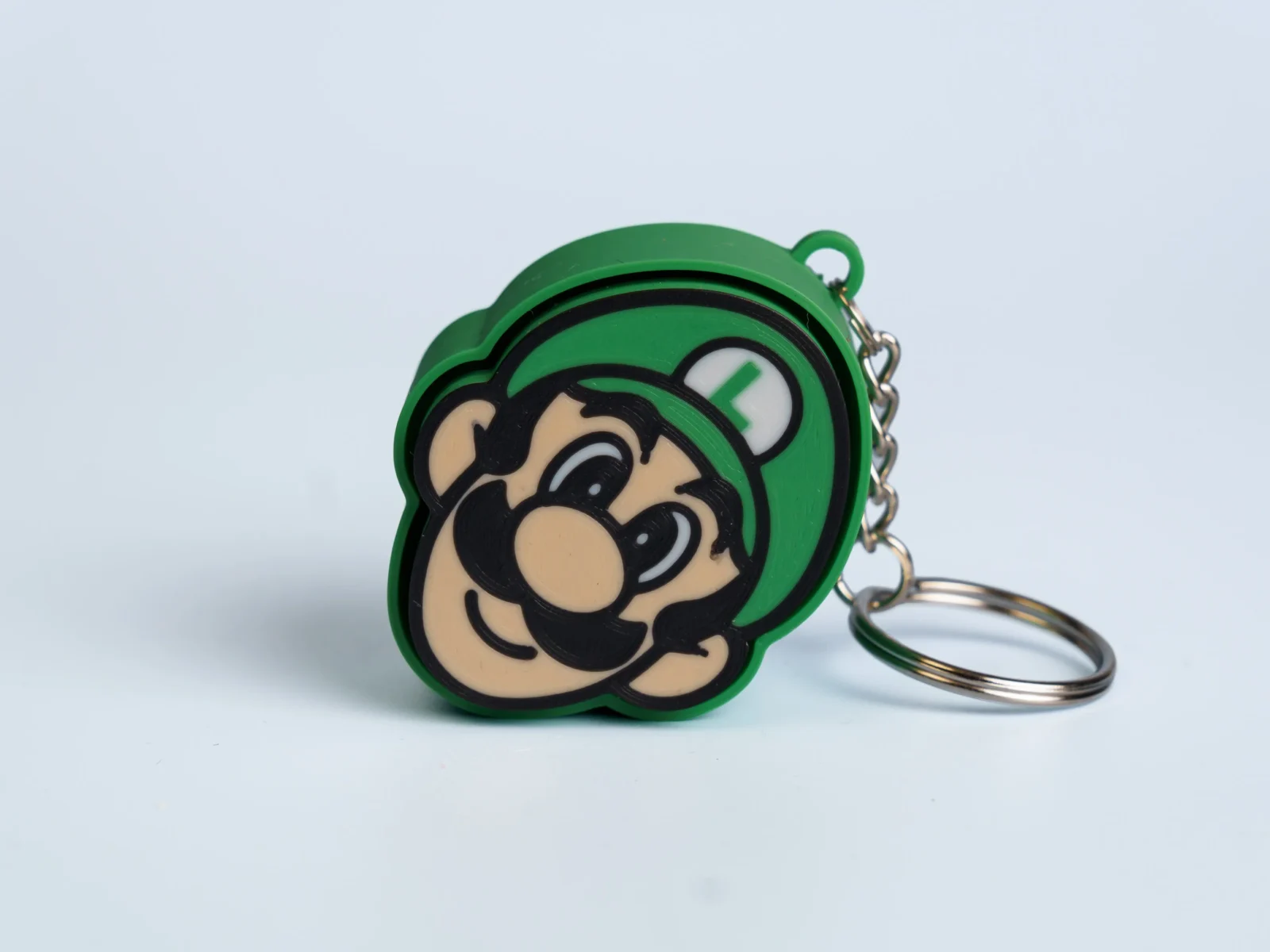 Arcade Quest Icons clicker fidget keychain - green cap hero